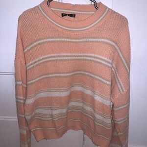 Pink and white wool sweater